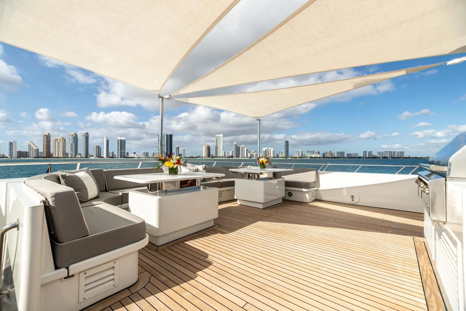 a room with a view of a city and a large body of water aboard EXPLORA Yacht for Sale
