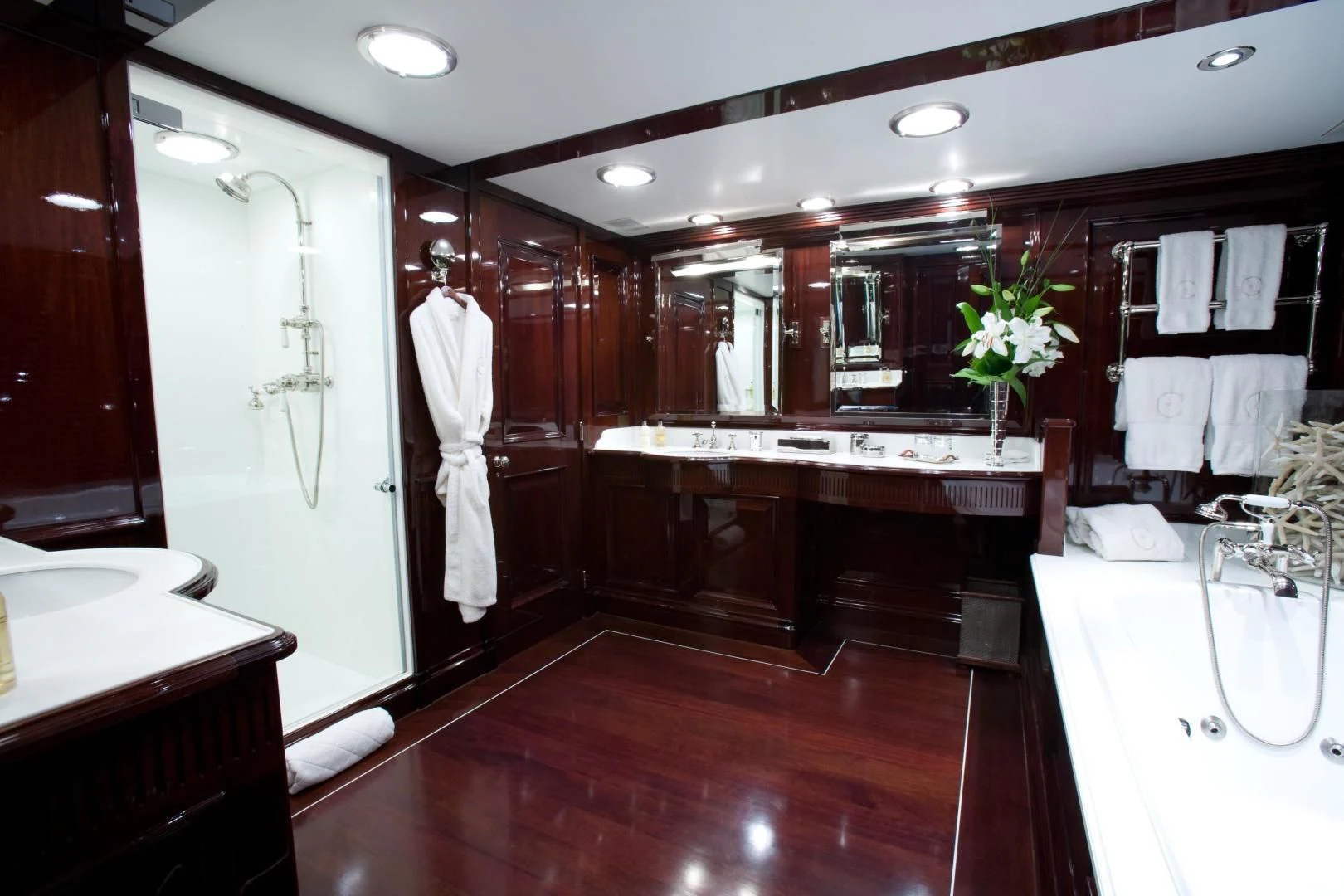 a bathroom with a large mirror aboard EXPLORA Yacht for Sale