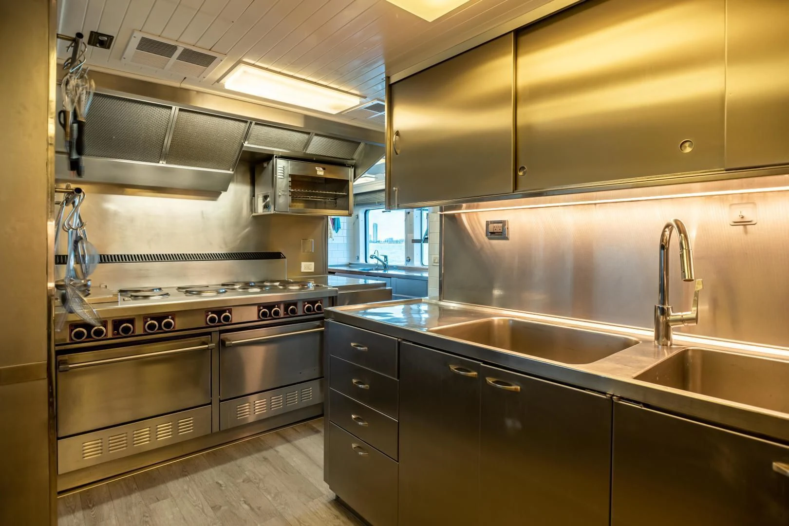 a kitchen with stainless steel appliances aboard EXPLORA Yacht for Sale
