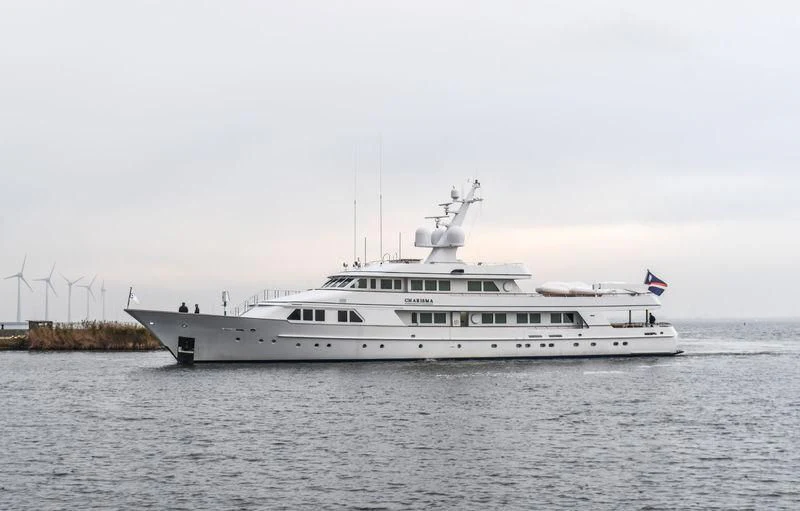 a large white boat in the water aboard EXPLORA Yacht for Sale