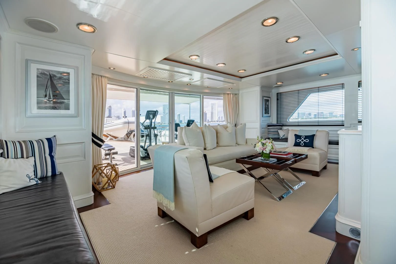 a living room with a large window aboard EXPLORA Yacht for Sale