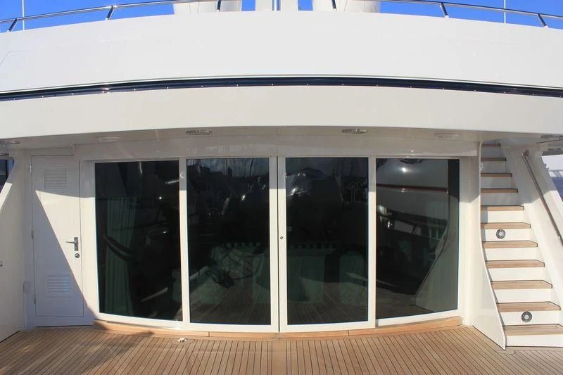 a white building with windows aboard EXPLORA Yacht for Sale