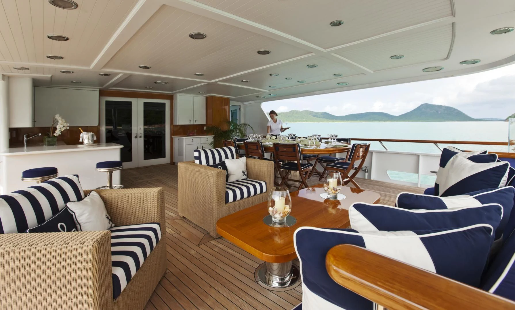 a living room with a large patio aboard EXPLORA Yacht for Sale