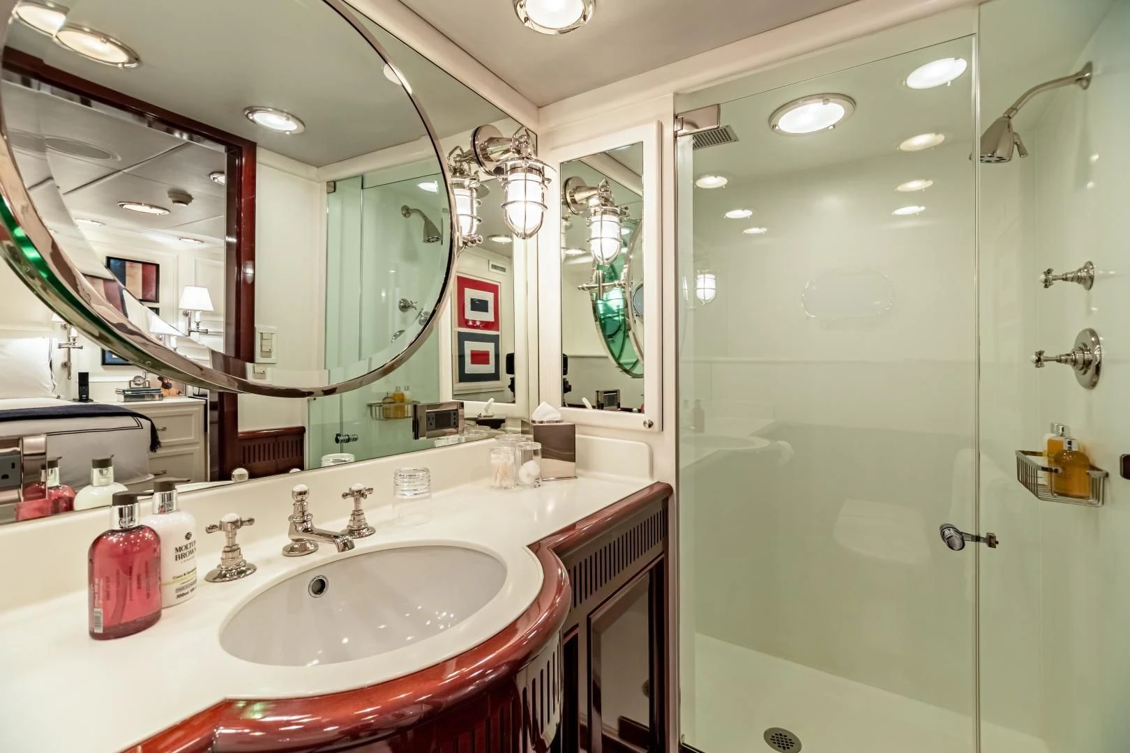 a bathroom with a large mirror aboard EXPLORA Yacht for Sale