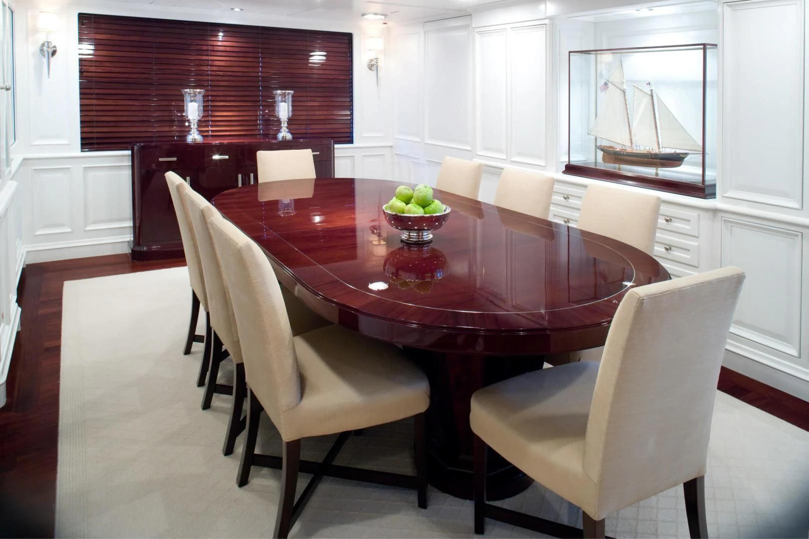 a dining table and chairs aboard EXPLORA Yacht for Sale
