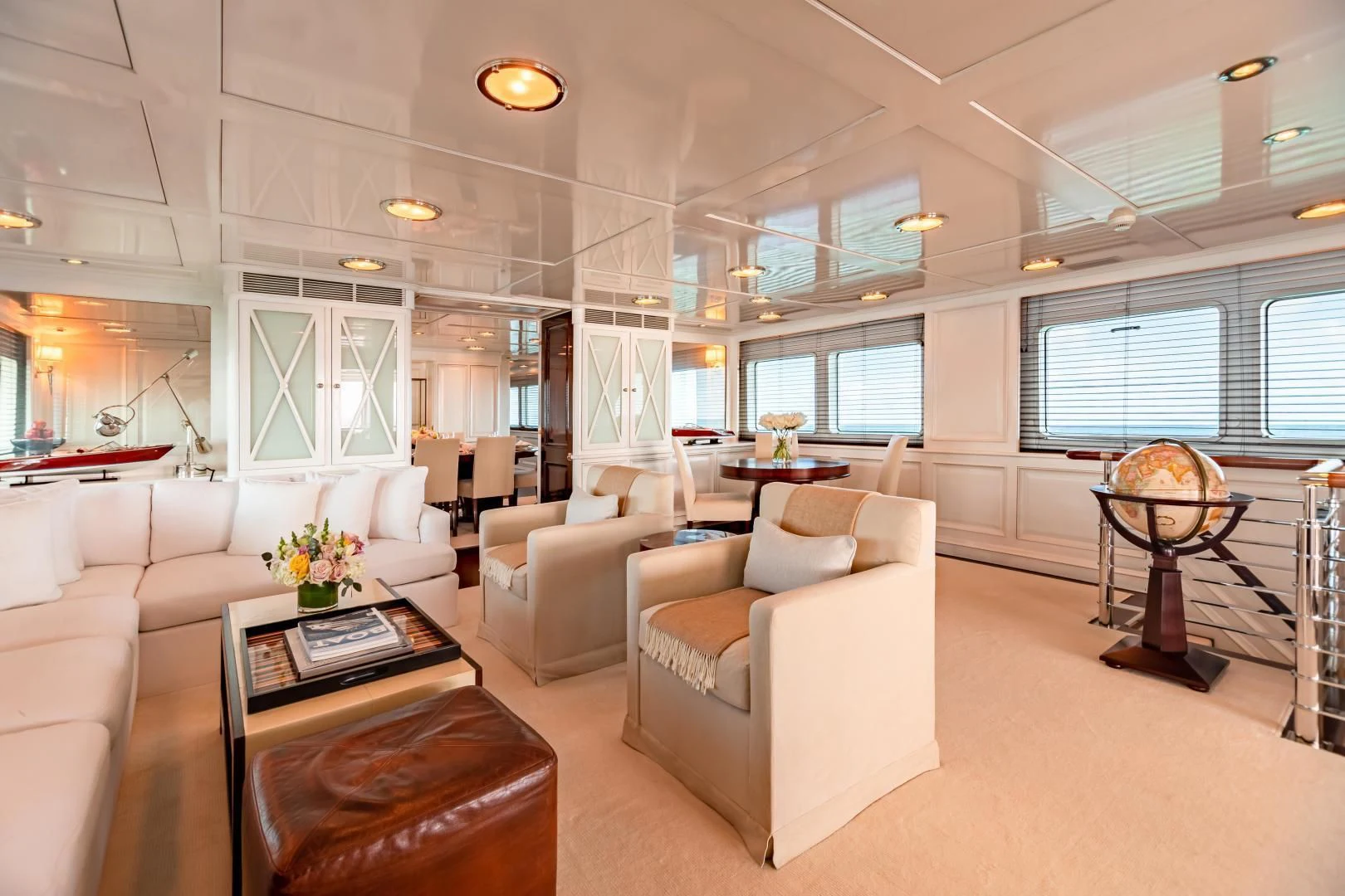 a living room with a large window aboard EXPLORA Yacht for Sale