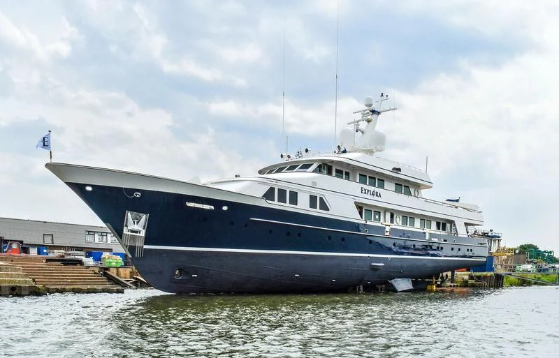 a large boat on the water aboard EXPLORA Yacht for Sale