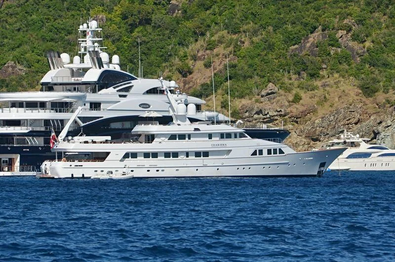 a large white boat in the water aboard EXPLORA Yacht for Sale