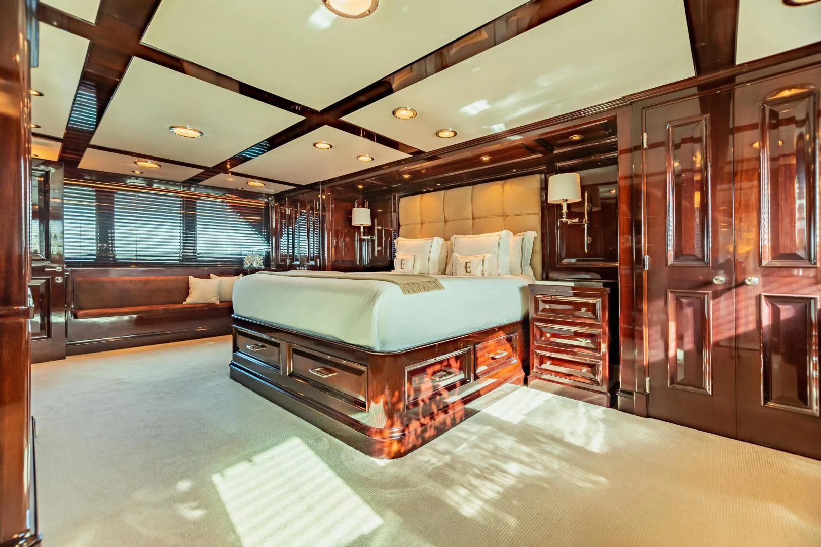 a large bedroom with a bed aboard EXPLORA Yacht for Sale