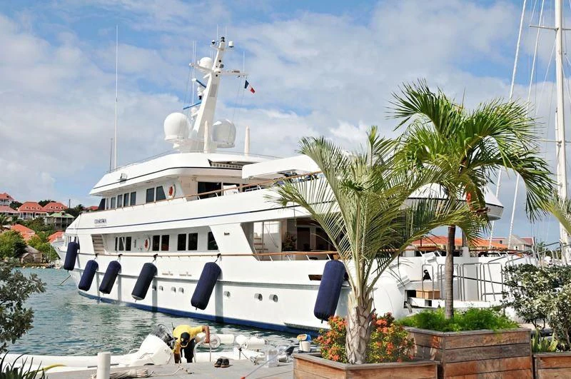 a boat docked at a pier aboard EXPLORA Yacht for Sale