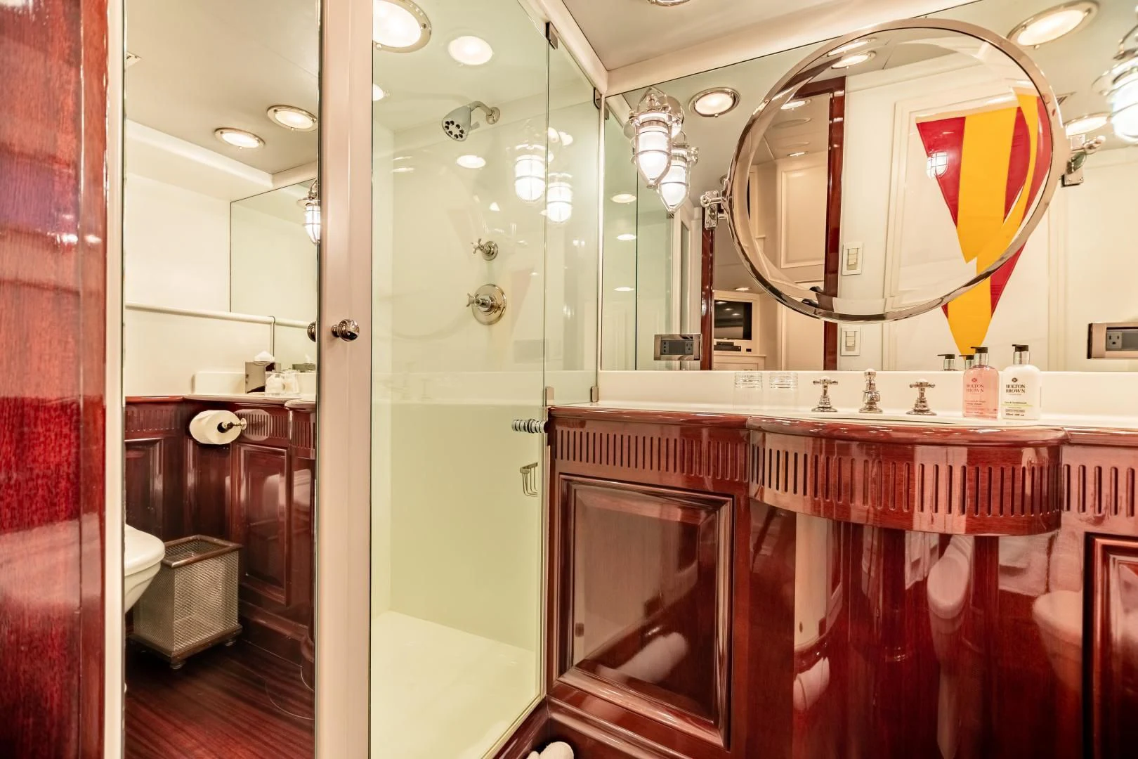 a bathroom with a large mirror aboard EXPLORA Yacht for Sale