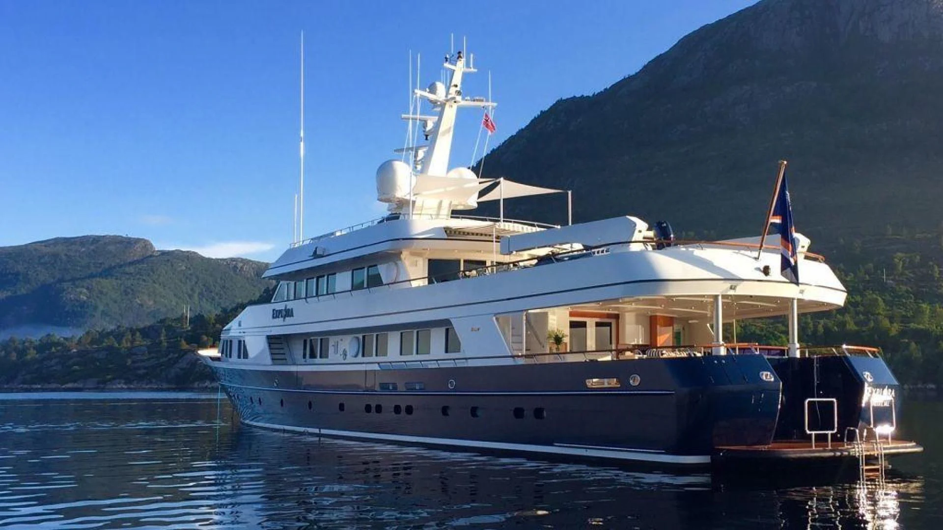 a large white boat in the water aboard EXPLORA Yacht for Sale