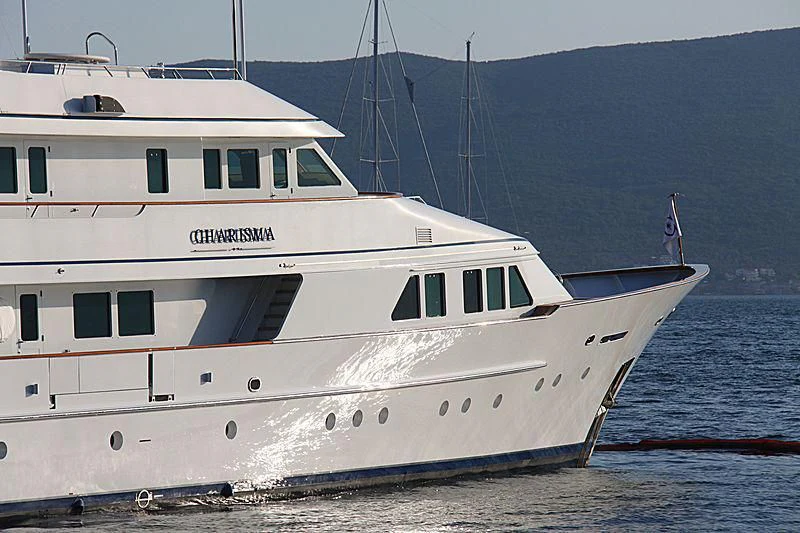 a white boat on the water aboard EXPLORA Yacht for Sale