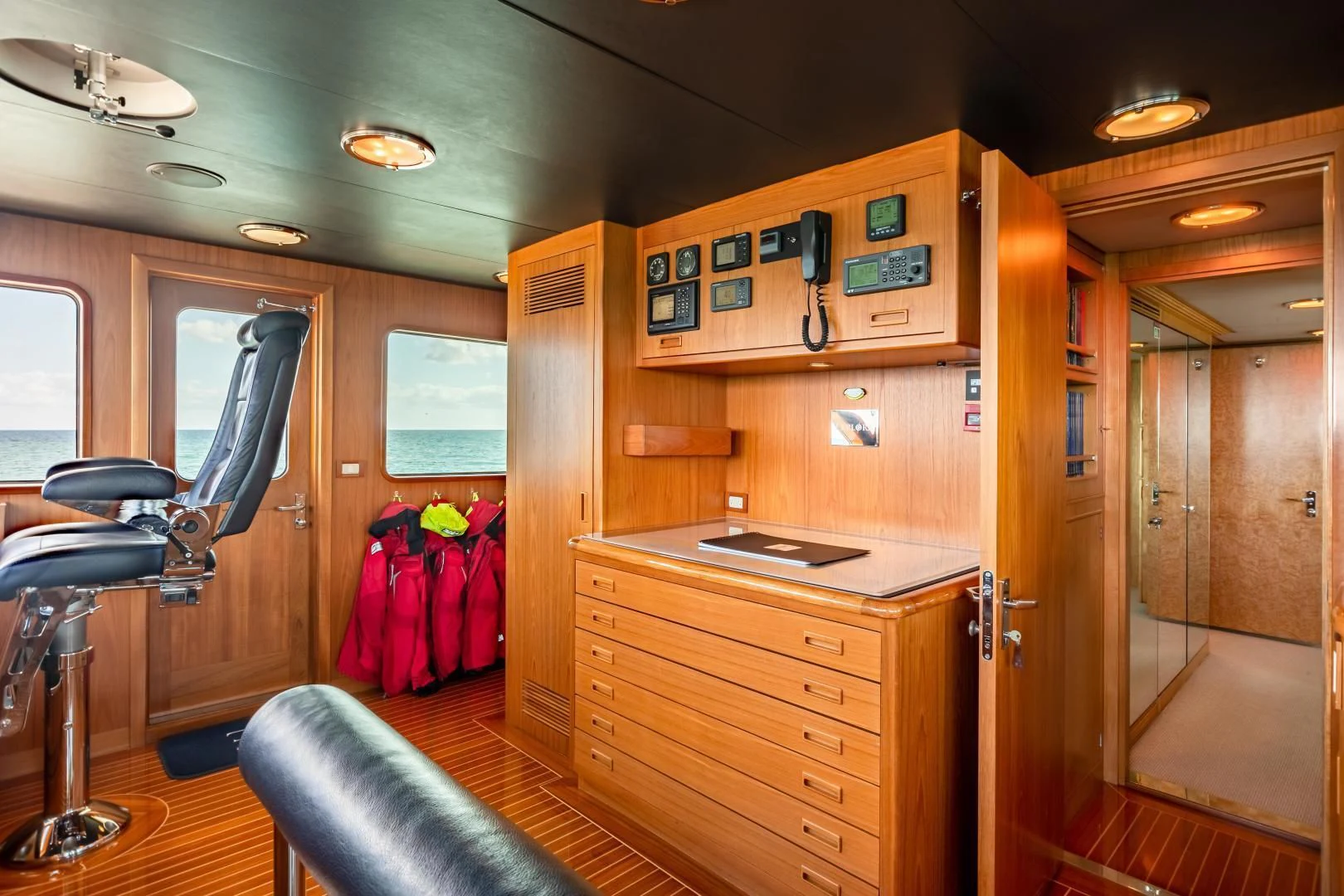 a room with a desk and a chair and a closet aboard EXPLORA Yacht for Sale