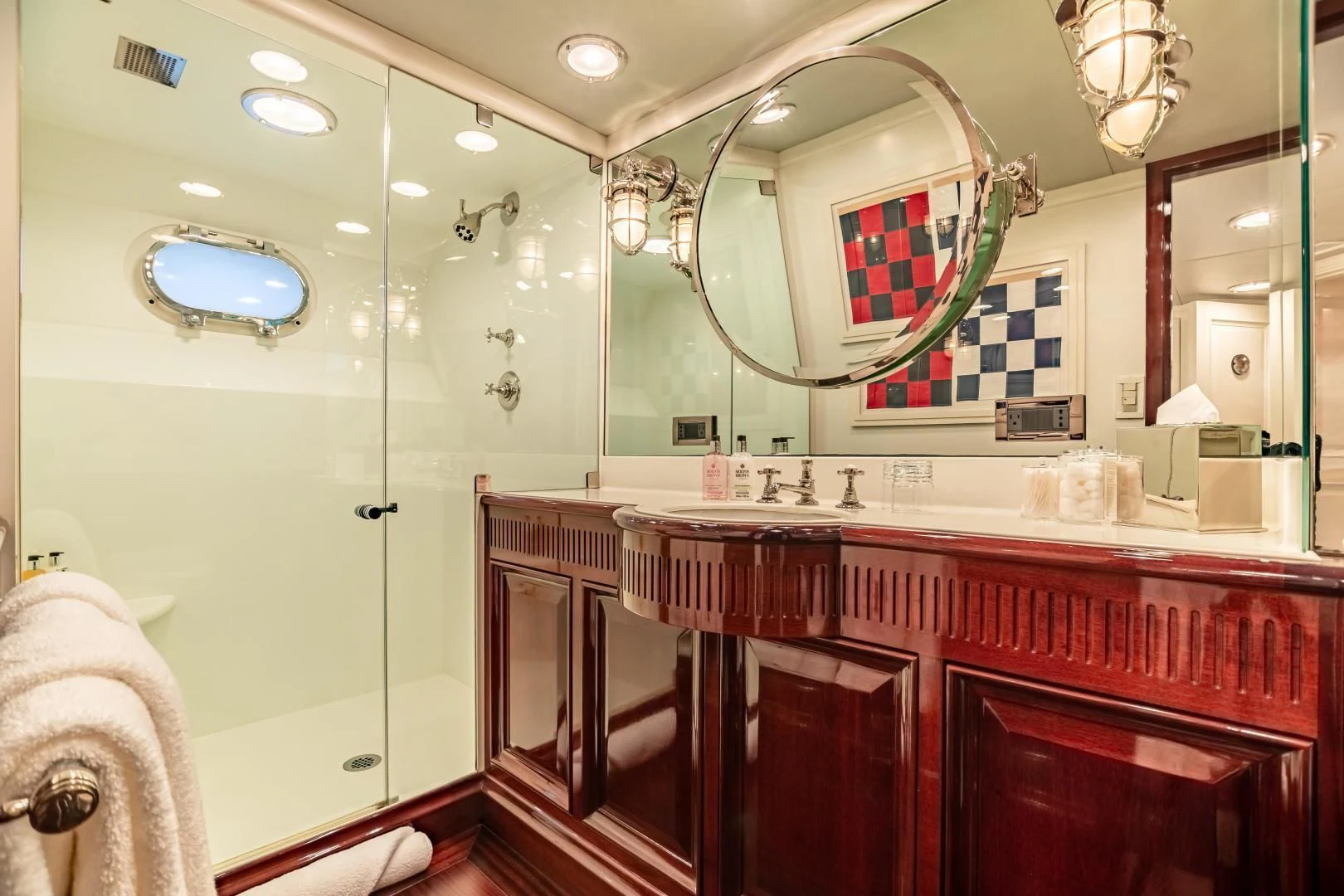 a bathroom with a large mirror aboard EXPLORA Yacht for Sale