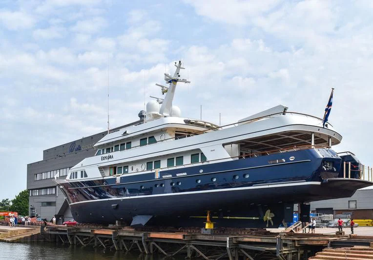 a large cruise ship docked aboard EXPLORA Yacht for Sale