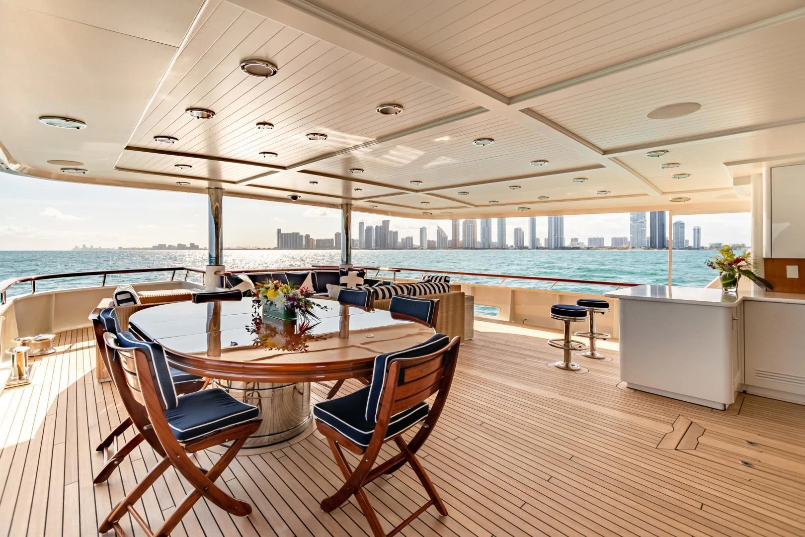 a table and chairs on a boat aboard EXPLORA Yacht for Sale