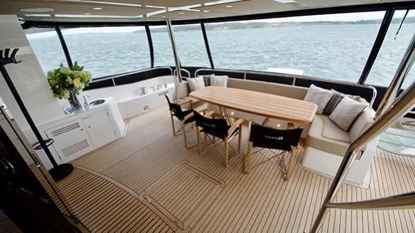 a room with a table and chairs aboard DUCHESSA Yacht for Sale