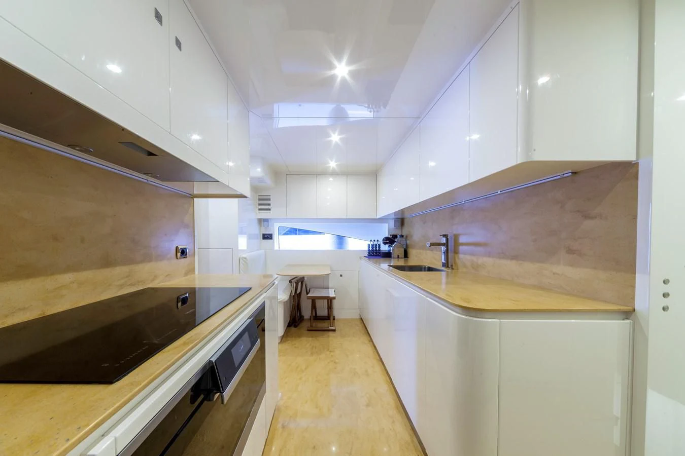 a kitchen with white cabinets aboard DUCHESSA Yacht for Sale