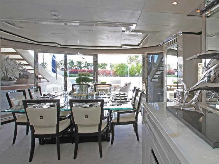 a room with a table and chairs aboard SEALYON Yacht for Sale