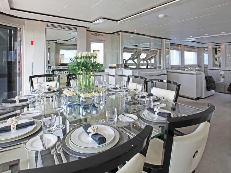 a dining room with a table set aboard SEALYON Yacht for Sale