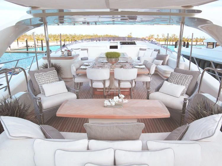 a lounge area with chairs and tables aboard SEALYON Yacht for Sale