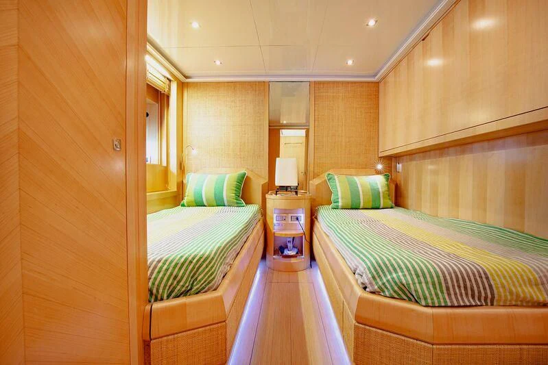 a room with two beds aboard ARION TERCERO Yacht for Sale