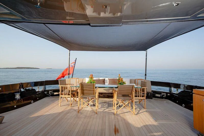 a room with a table and chairs aboard ARION TERCERO Yacht for Sale