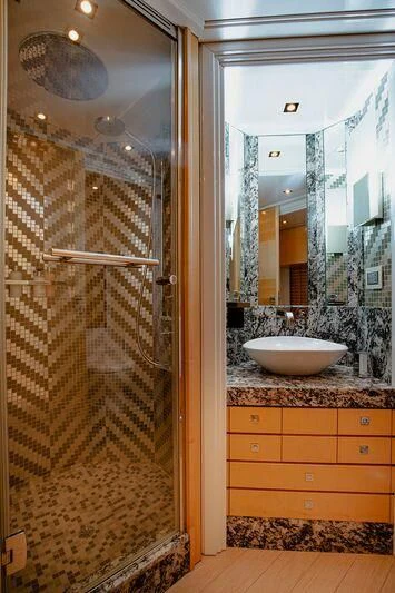 a bathroom with a marble countertop aboard ARION TERCERO Yacht for Sale