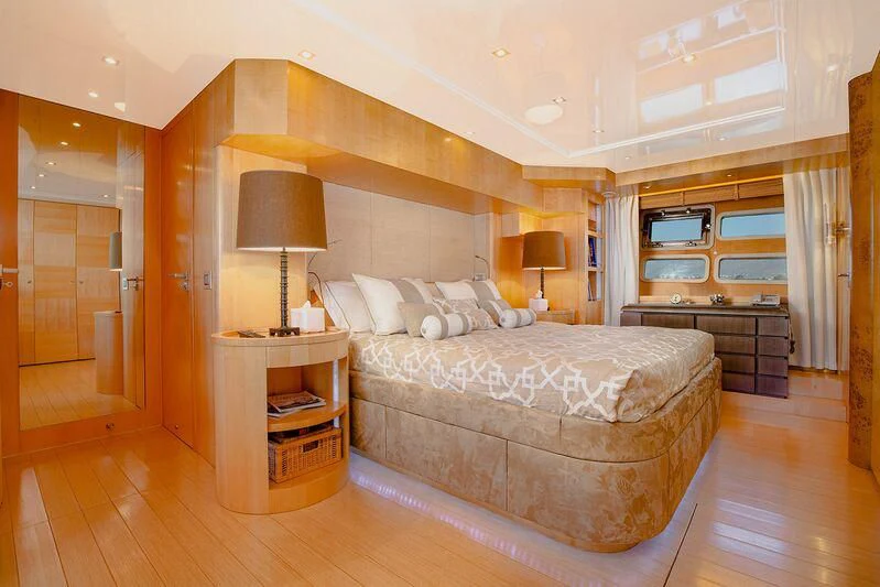 a large bed in a room aboard ARION TERCERO Yacht for Sale