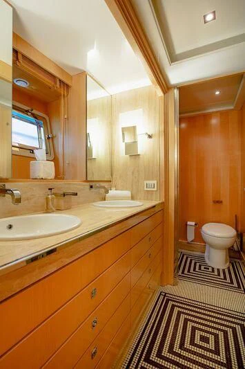 a bathroom with a sink and a mirror aboard ARION TERCERO Yacht for Sale