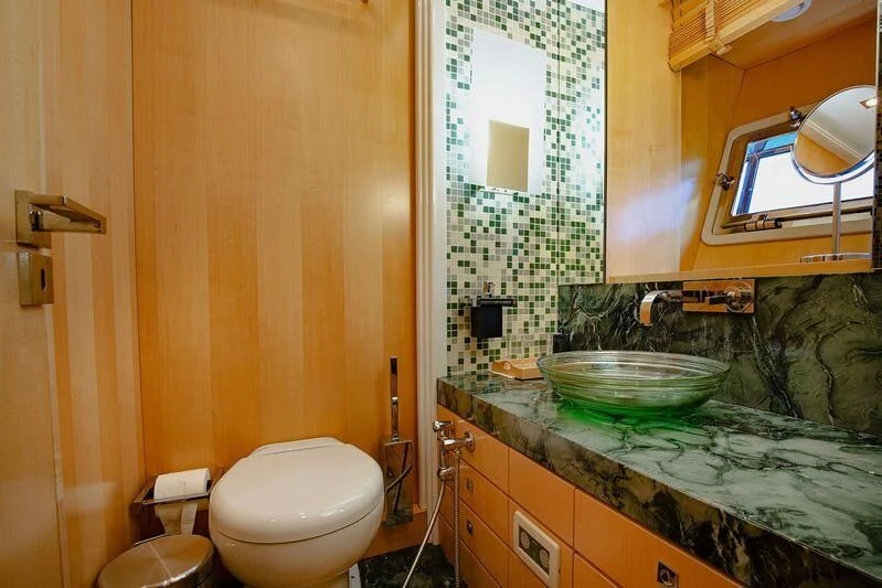 a bathroom with a glass bowl aboard ARION TERCERO Yacht for Sale