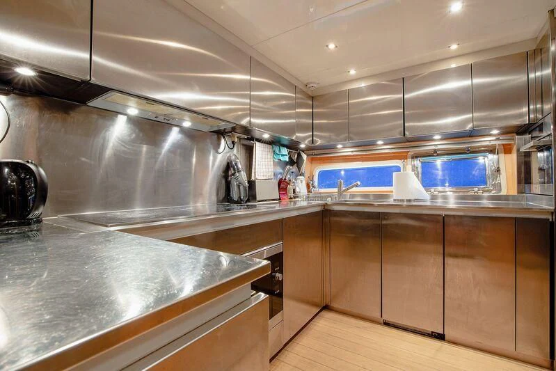 a kitchen with stainless steel appliances aboard ARION TERCERO Yacht for Sale