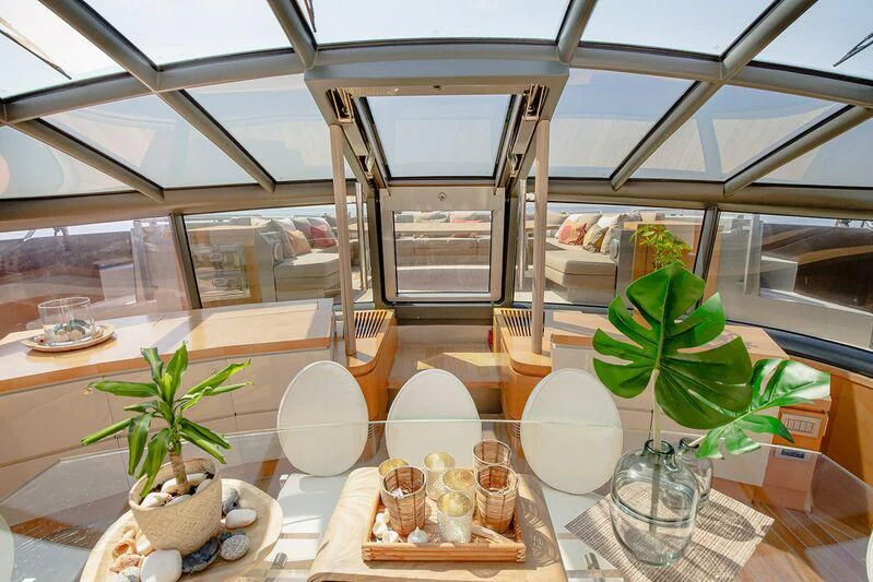 a room with a plant and a shelf with objects on it aboard ARION TERCERO Yacht for Sale