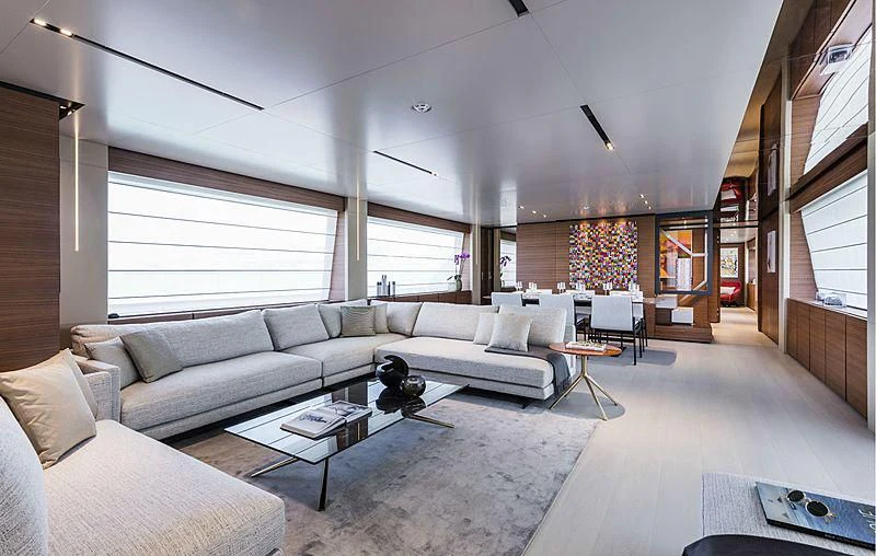 a living room with a couch and a coffee table aboard MY LARA Yacht for Sale