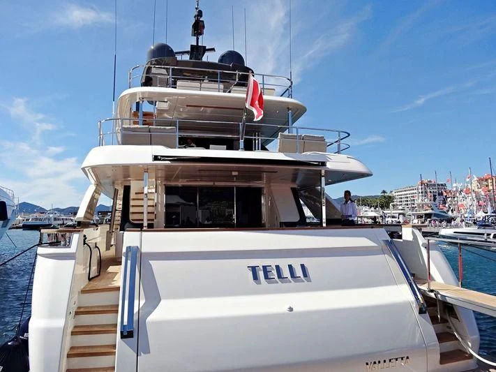 a boat with a flag on the front aboard MY LARA Yacht for Sale