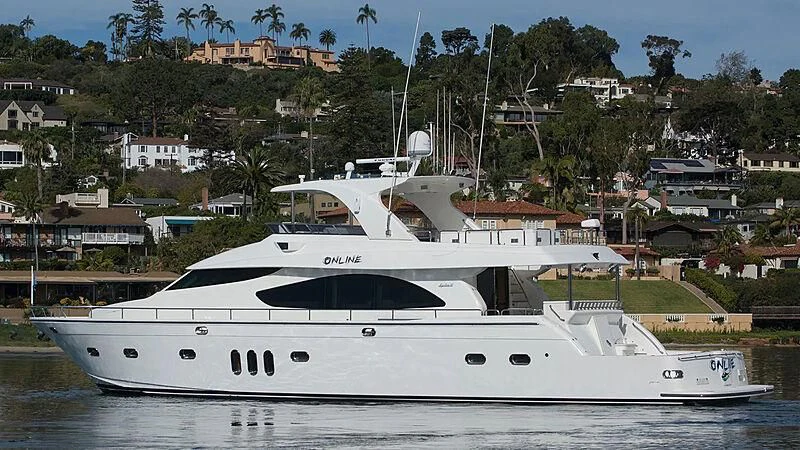 a white yacht in the water aboard FULL HOUSE Yacht for Sale