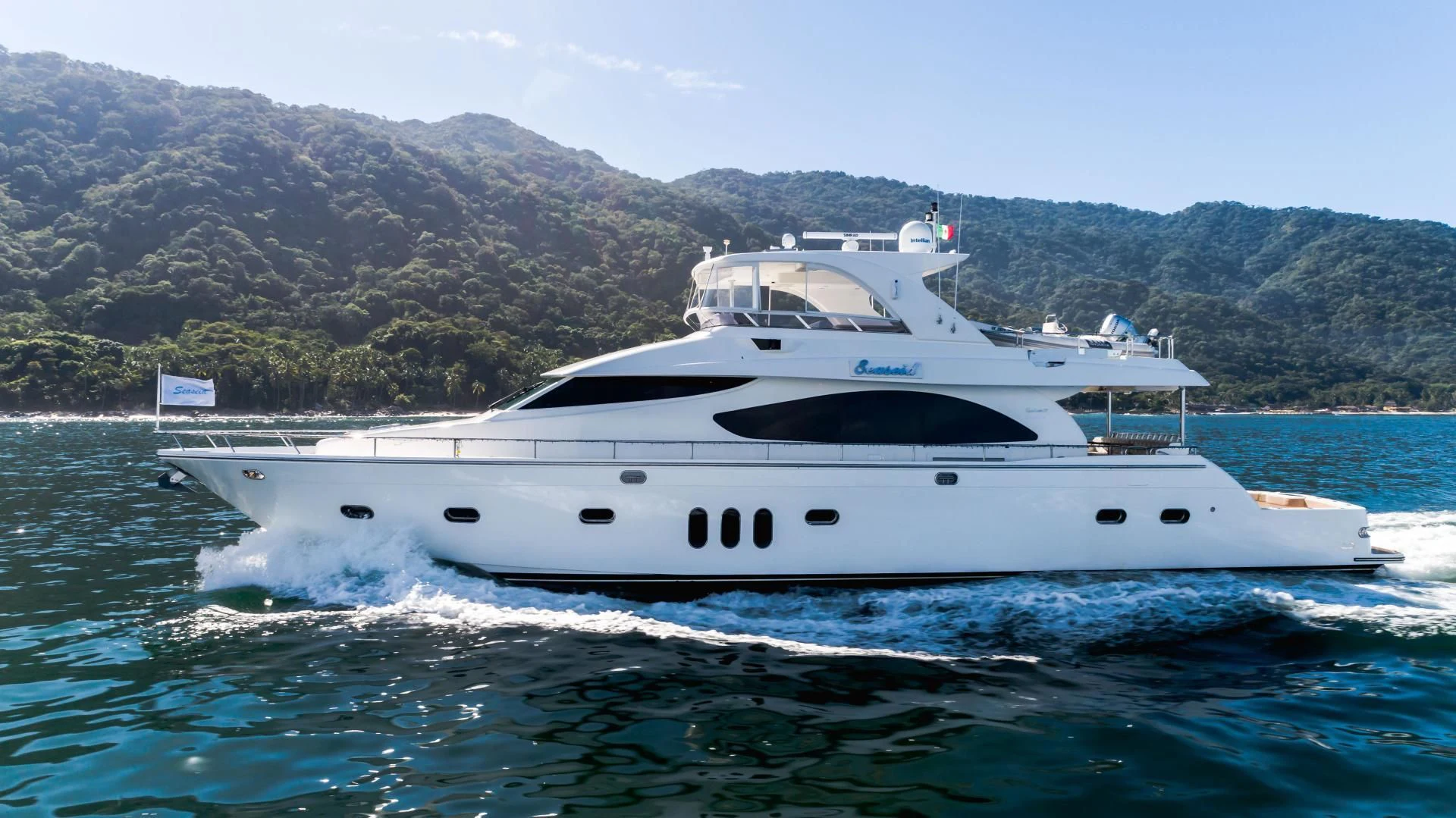 a white yacht on the water aboard FULL HOUSE Yacht for Sale