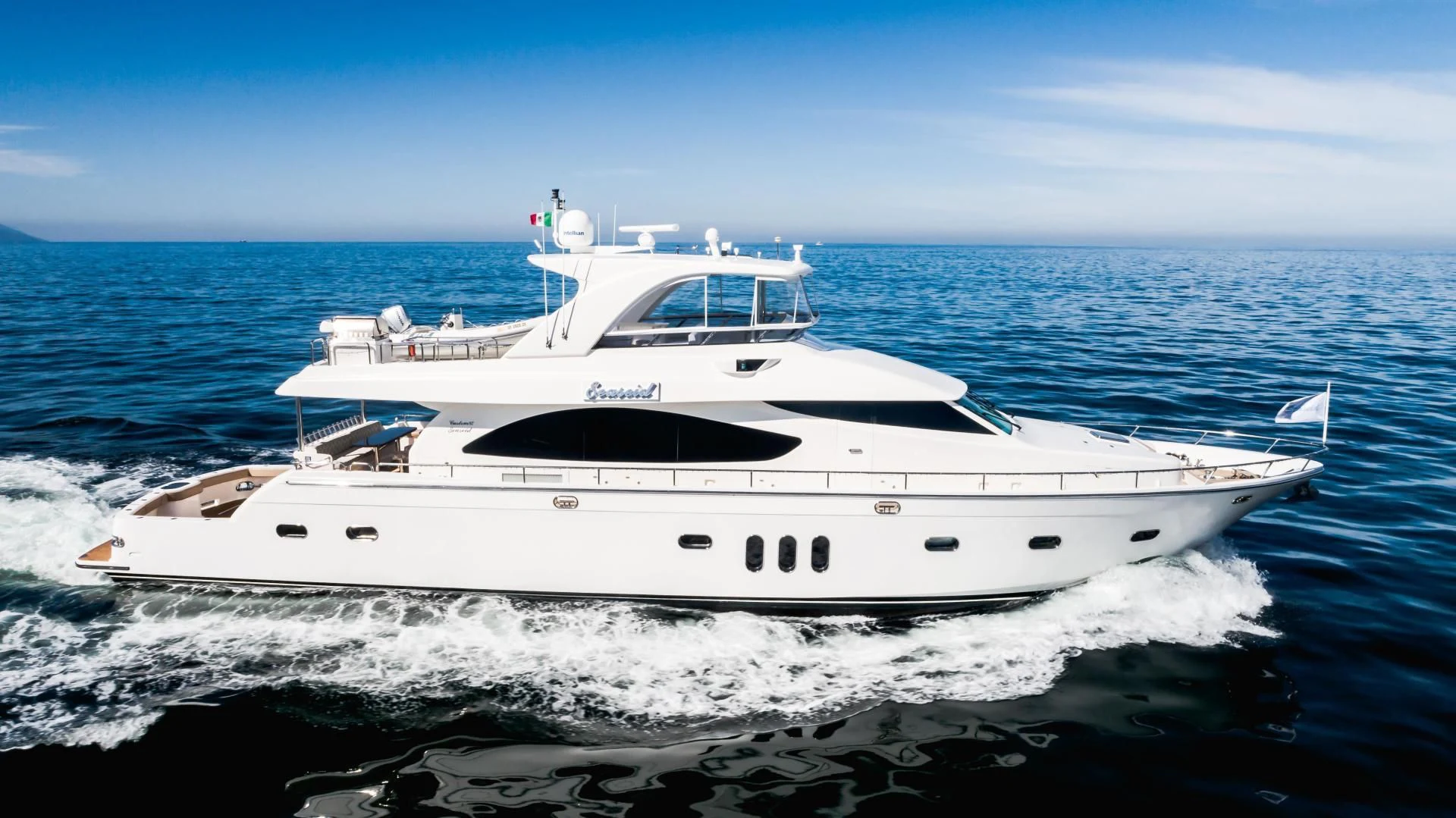 a white yacht in the water aboard FULL HOUSE Yacht for Sale