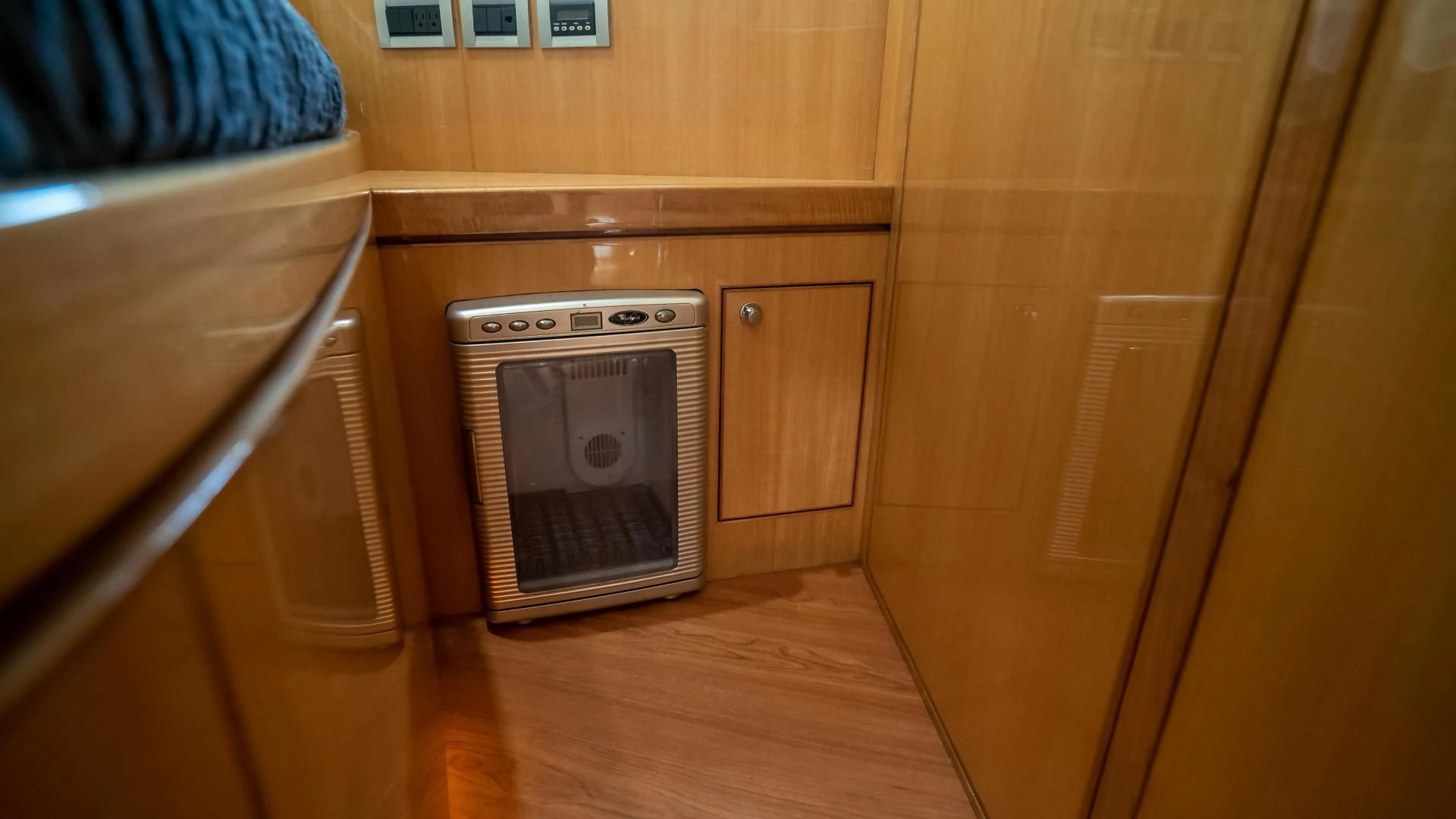 a kitchen with wooden cabinets aboard FULL HOUSE Yacht for Sale