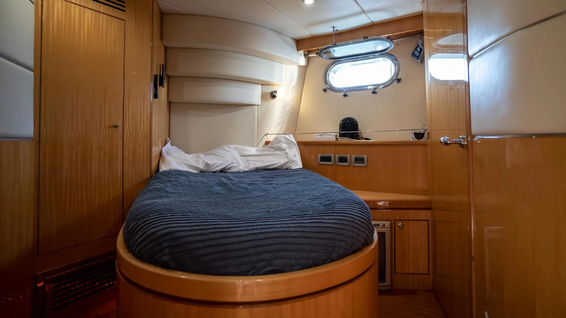 a bed in a room aboard FULL HOUSE Yacht for Sale