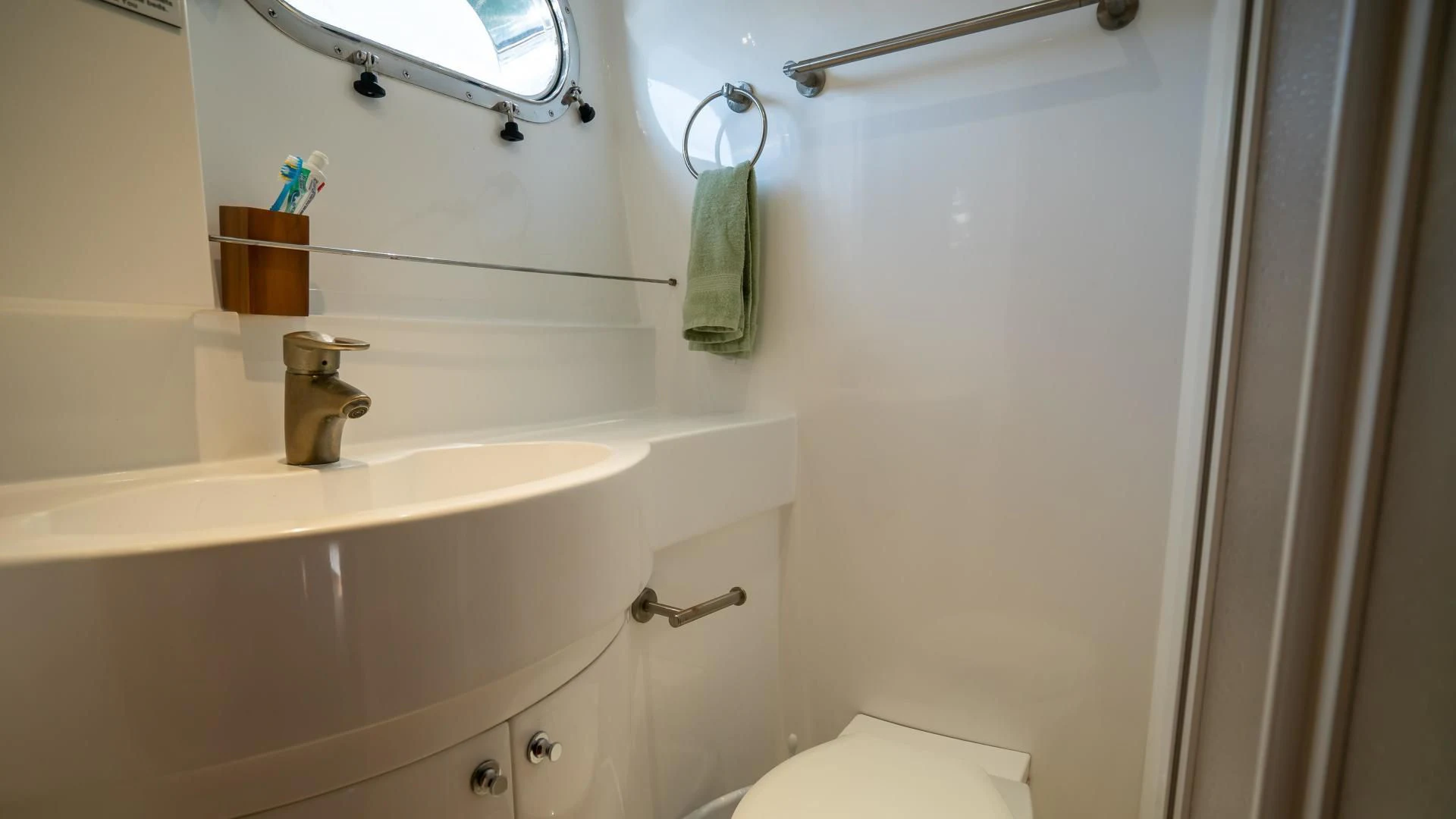 a bathroom with a sink and a toilet aboard FULL HOUSE Yacht for Sale