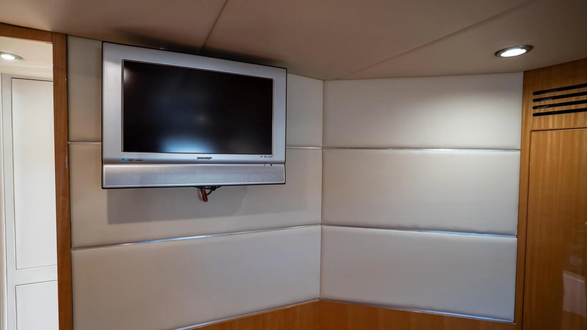 a tv on a wall aboard FULL HOUSE Yacht for Sale