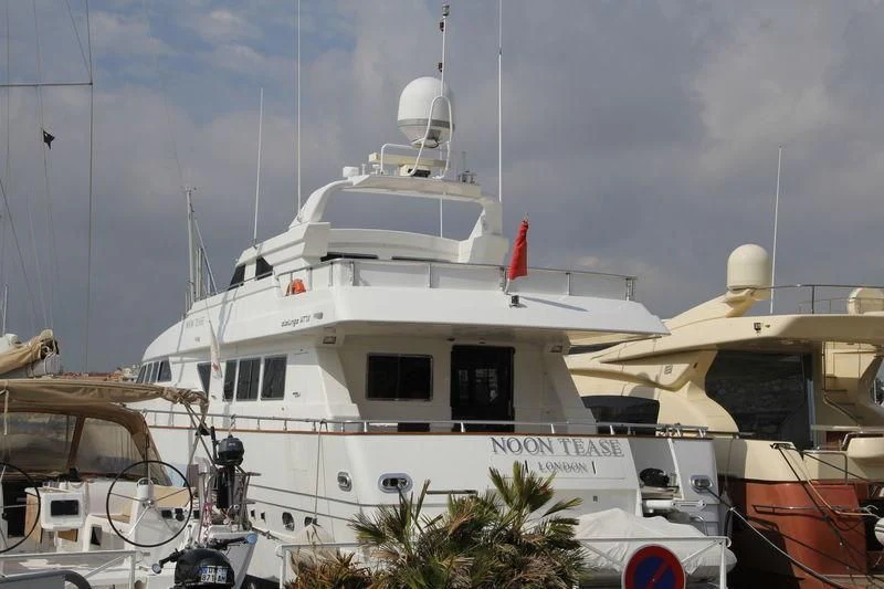 a white boat docked aboard SERENE SEAS Yacht for Sale