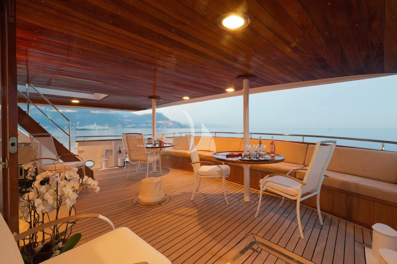 a room with a table and chairs aboard SHAHA Yacht for Sale