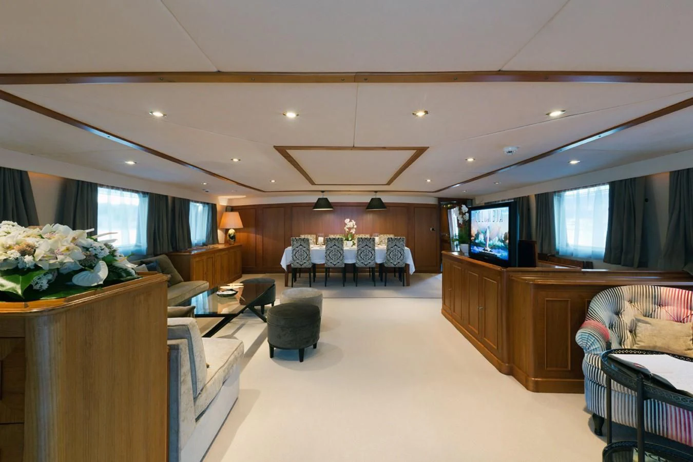 a living room with a large window aboard SHAHA Yacht for Sale