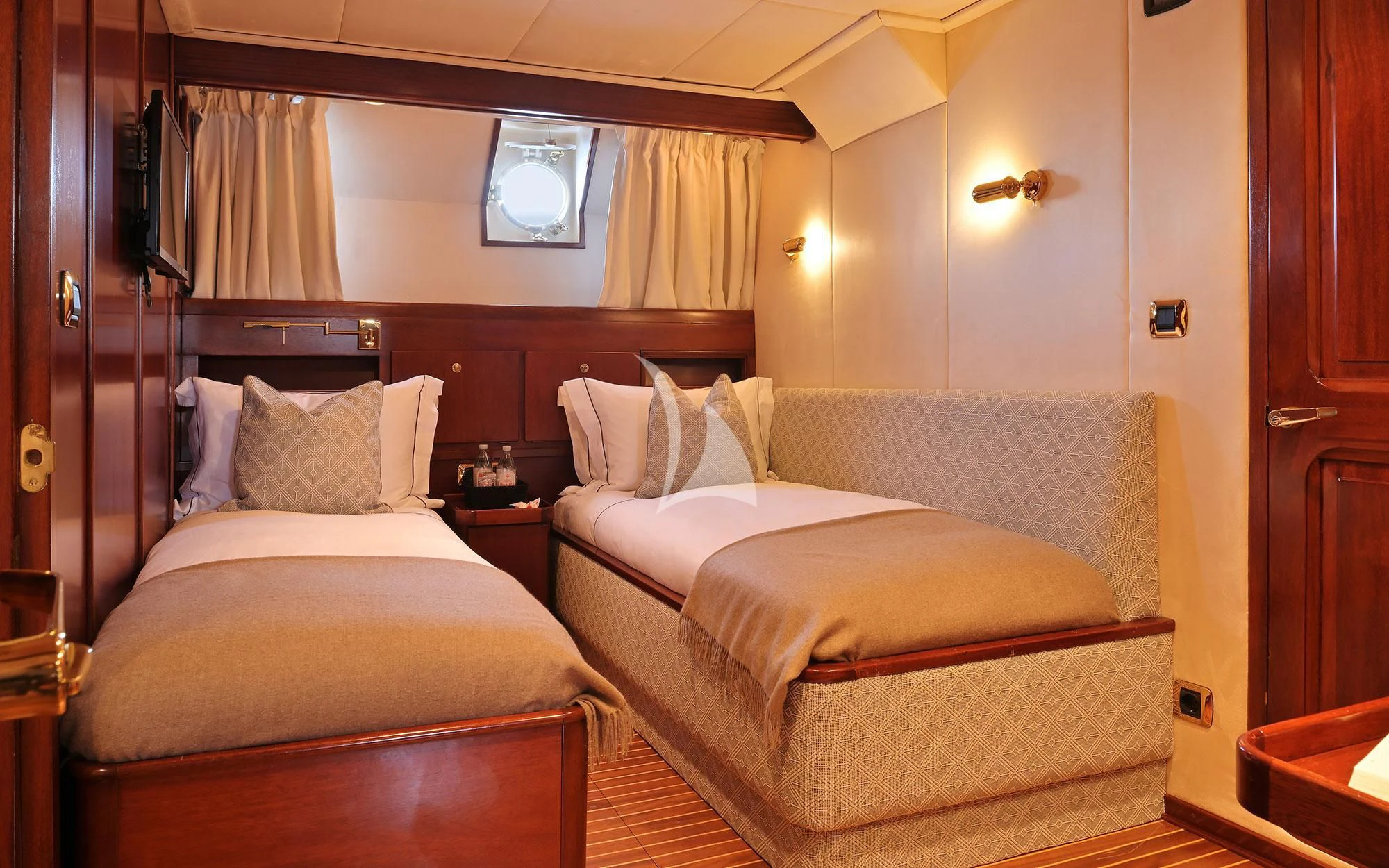 a couple of beds in a room aboard SHAHA Yacht for Sale