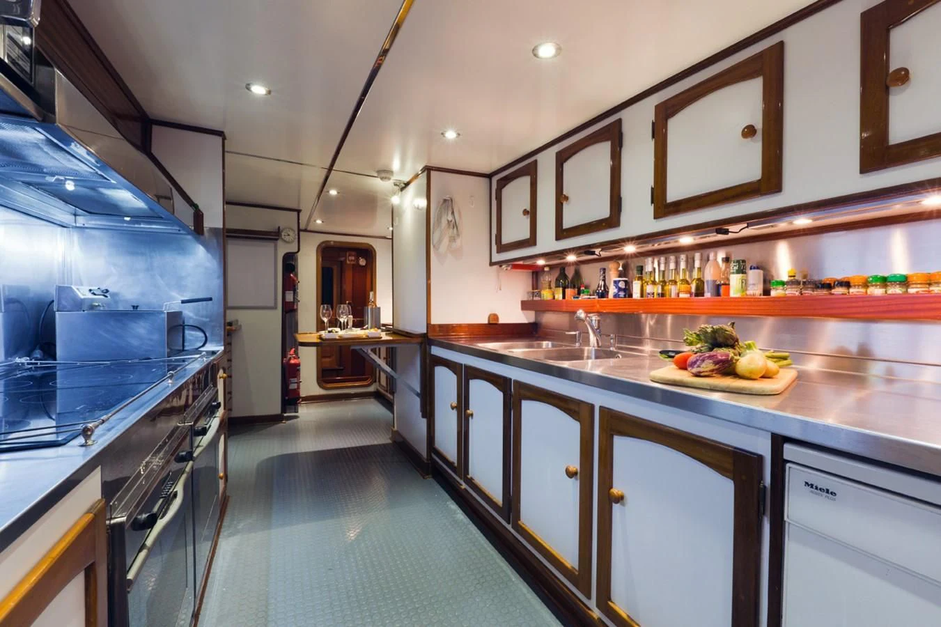 a kitchen with a large island aboard SHAHA Yacht for Sale