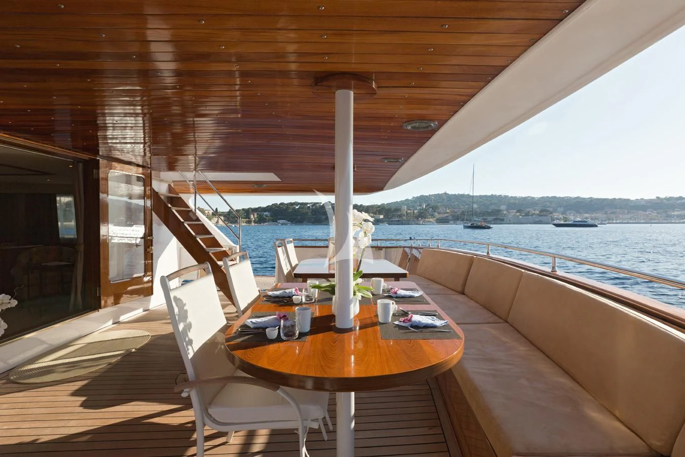 a table on a deck aboard SHAHA Yacht for Sale