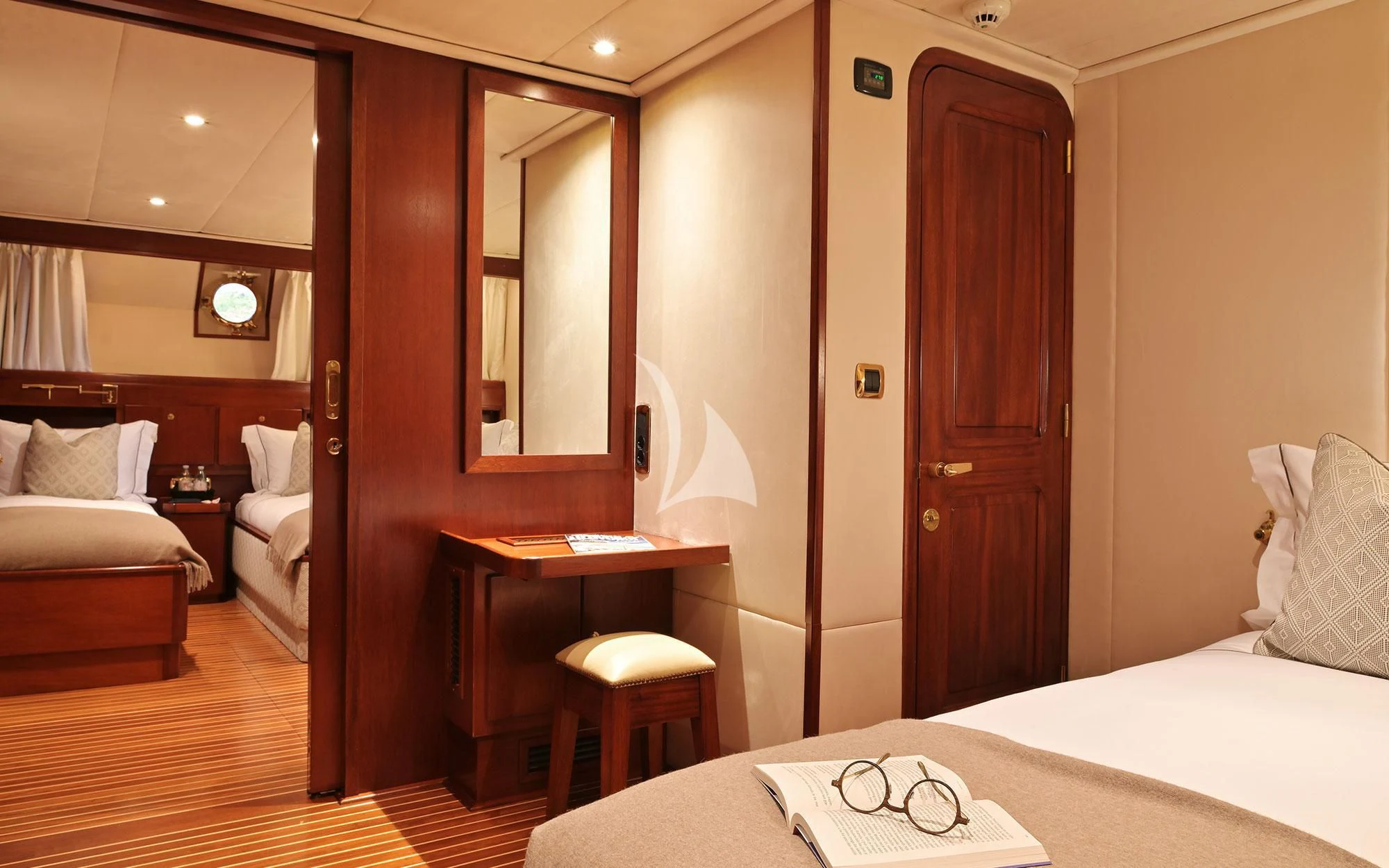 a hotel room with a bed and desk aboard SHAHA Yacht for Sale